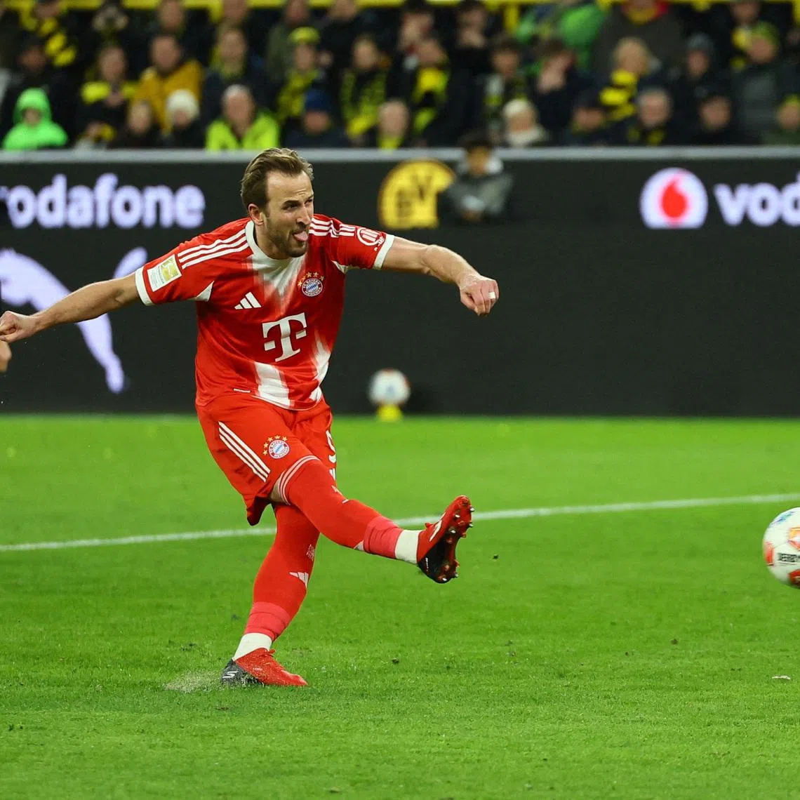 Soccer Football - Bundesliga - Borussia Dortmund v Bayern Munich - Signal Iduna Park, Dortmund, Germany - February 28, 2026 Bayern Munich's Harry Kane scores their second goal from the penalty spot REUTERS/Wolfgang Rattay