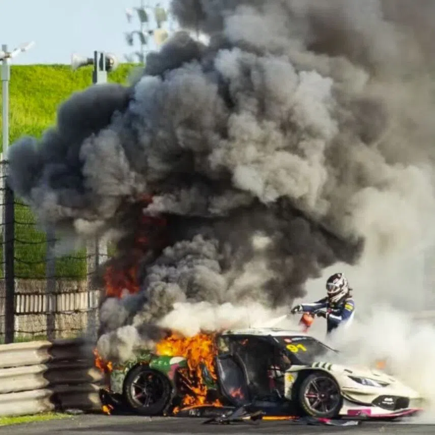 Loek Hartog used a fire extinguisher on Ollie Millroy’s Ferrari as a blaze raged before yanking open the driver’s door and dragging him to safety.