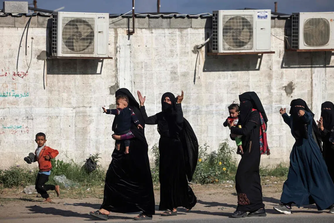 Residents in the Gaza Strip flee their homes to move away from the border with Israel on Oct 7, 2023.