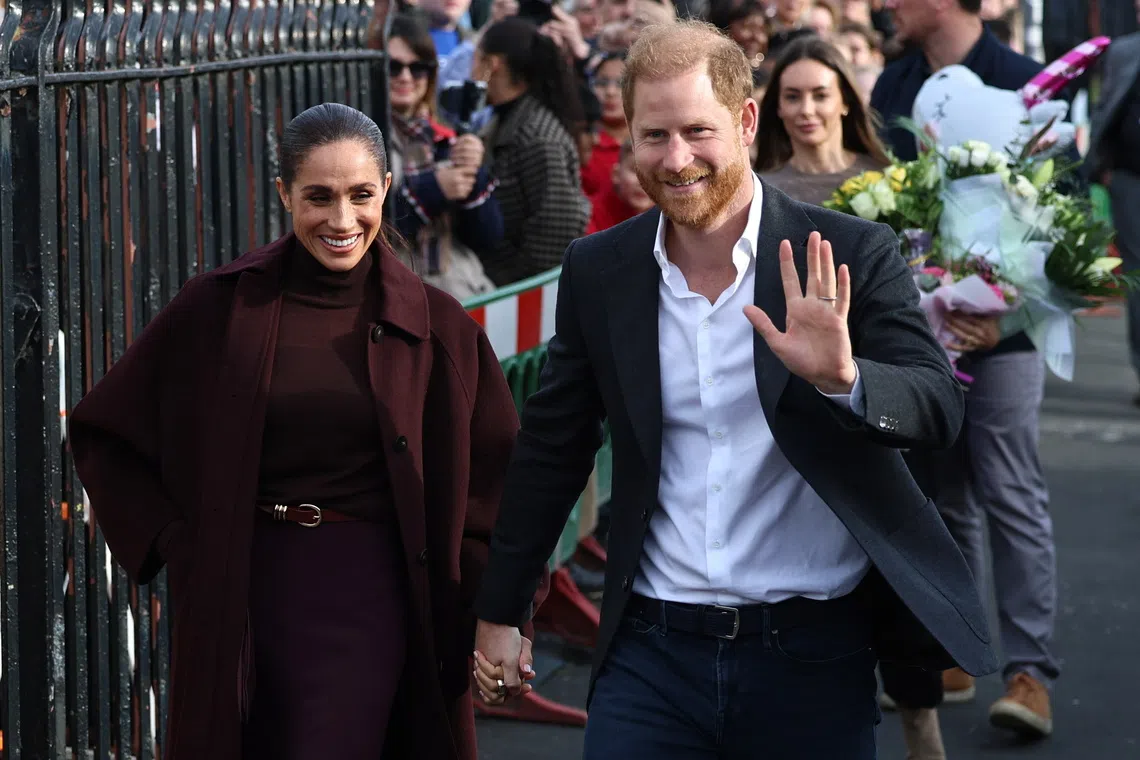 Prince Harry and his wife Meghan arriving at the Community Recording Studio in Nottingham, Britain, on Oct 15.