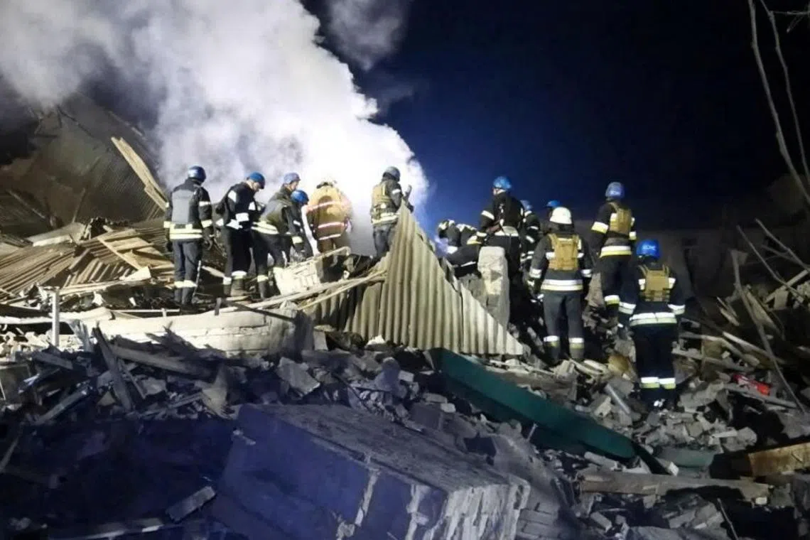 Rescuers working at the site of a maternity ward of a hospital destroyed by a Russian missile attack in Vilniansk, Zaporizhzhia region, Ukraine on Nov 23.