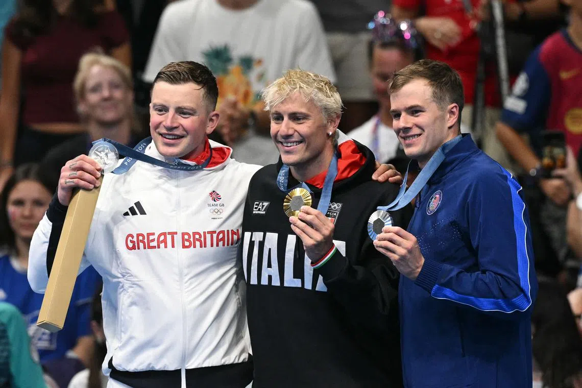 (From left) Britain's Adam Peaty, Italy's Nicolo Martinenghi and the US' Nic Fink after the men's 100m breaststroke in Paris on July 28.