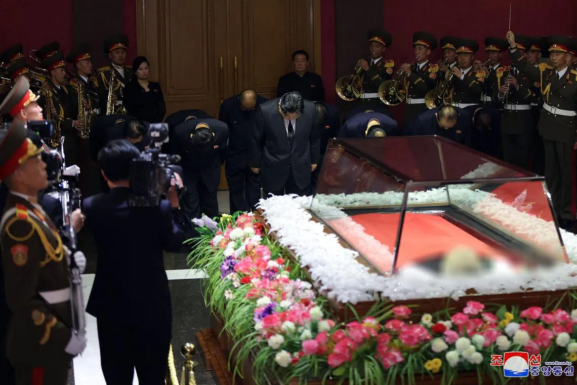 North Korea's leader Kim Jong Un (centre) and senior officials expressing their condolences to Mr Kim Ki Nam who died on May 7.