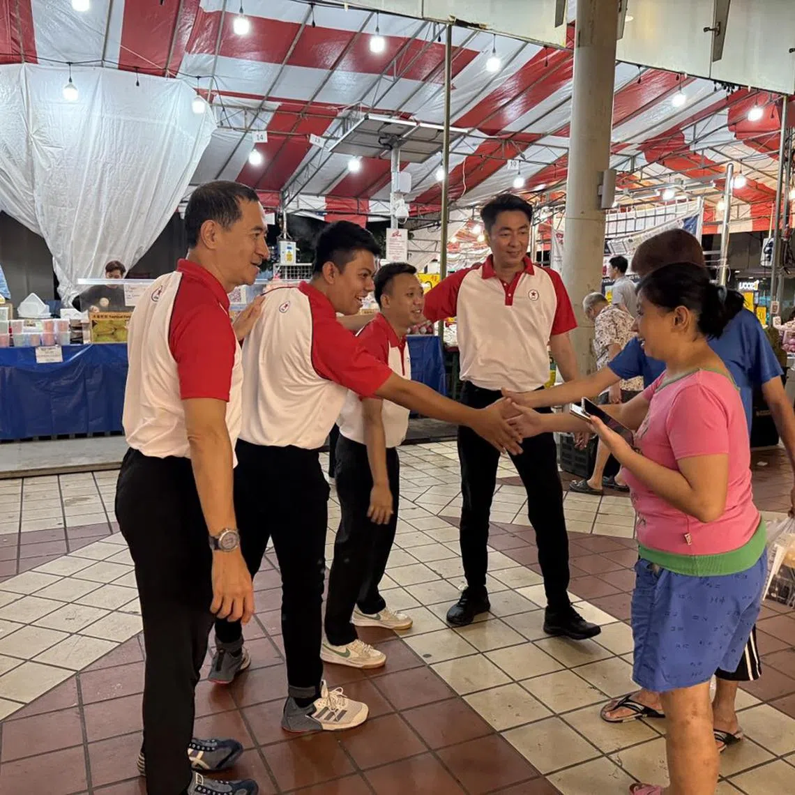 slspp01 - Singapore People’s Party candidates contesting Bishan-Toa Payoh GRC at GE2025 speaking to people at Bishan Bus Interchange on May 1. (from left) Mr Steve Chia, Mr Muhammad Norhakim, Mr Lim Rui Xian and Mr Melvyn Chiu. 

ST PHOTO: SAMUEL DEVARAJ