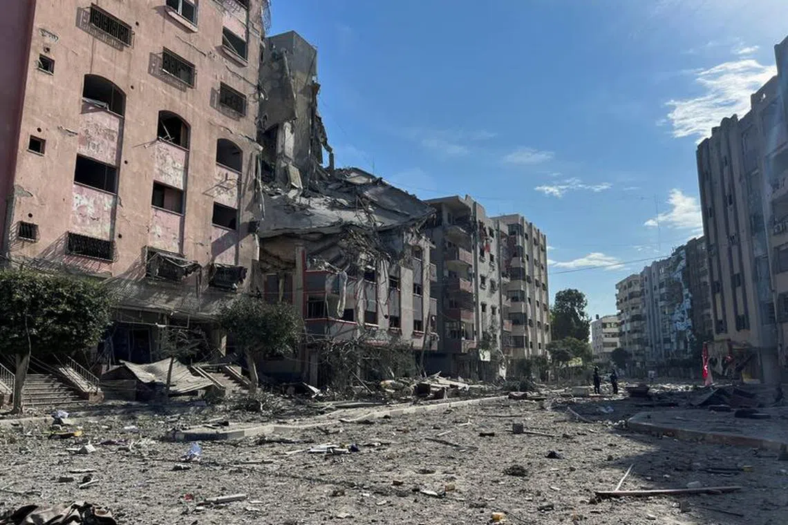 Damaged residential buildings are seen in the aftermath of Israeli strikes, near Al-Quds hospital in Gaza City October 30, 2023. REUTERS/Mohammed Al-Masri