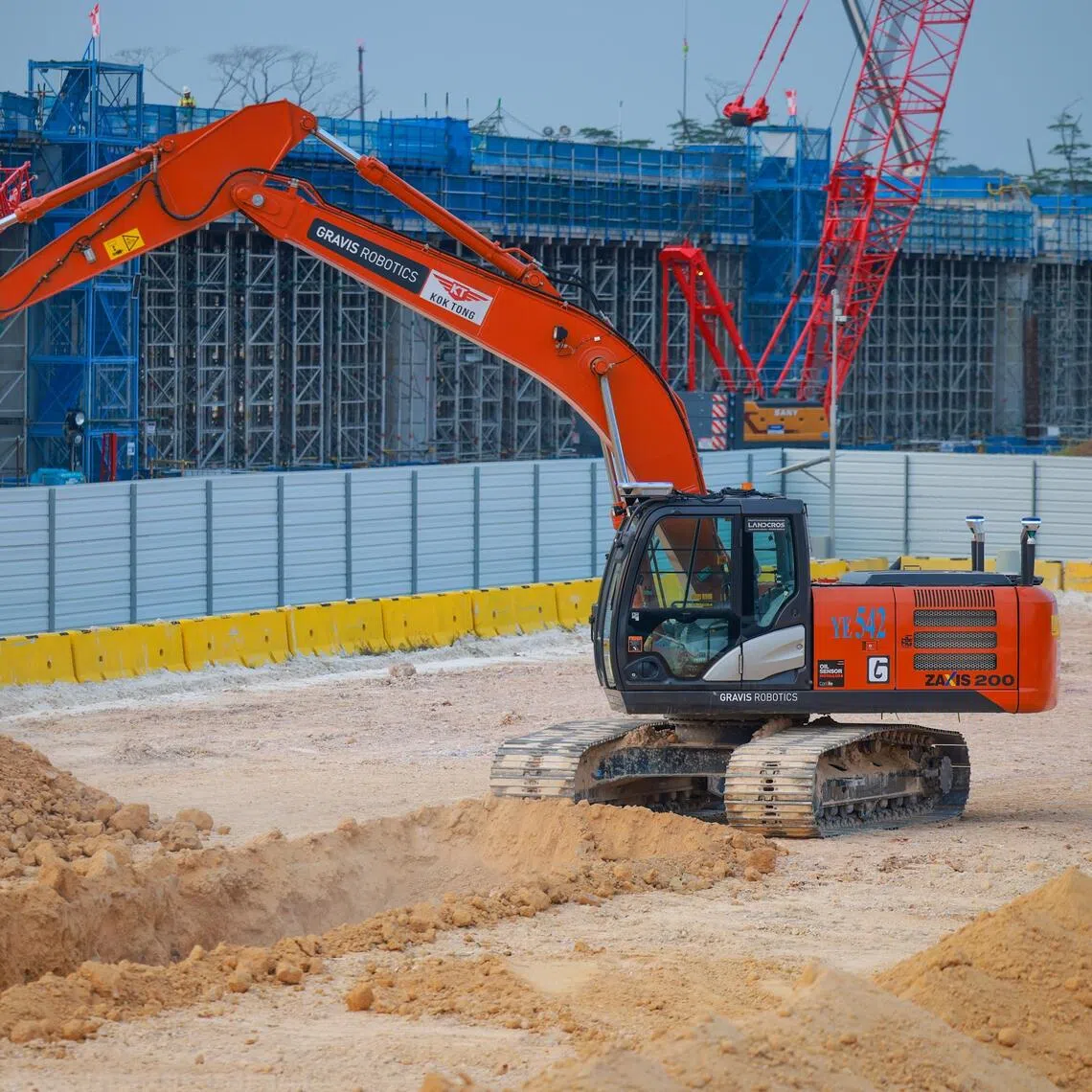 An autonomous excavator during a trial at Bulim autonomous yard on Sept 16, as the JTC-Kajima project aims to halve skilled operator needs and keep workers out of hazard zones.