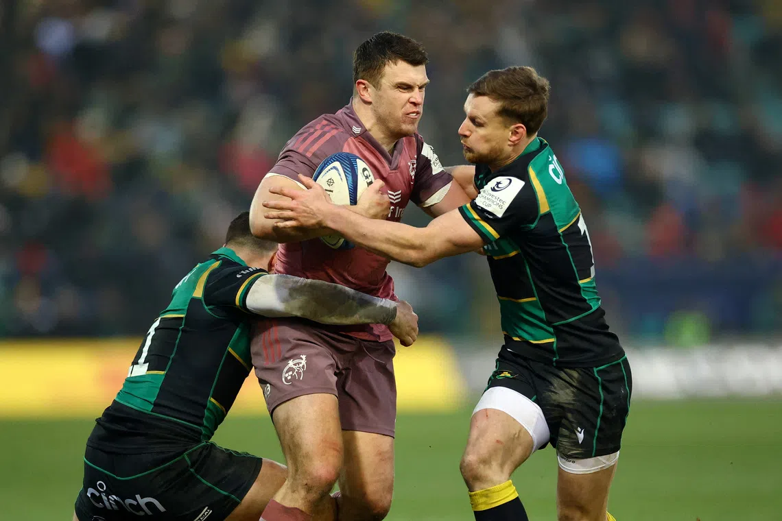 FILE PHOTO: Rugby Union - European Champions Cup - Pool 3 - Northampton Saints v Munster - Franklin's Gardens, Northampton, Britain - January 18, 2025 Munster'sTom Farrell in action with Northampton Saints' Tom Seabrook and Rory Hutchinson Action Images via Reuters/Andrew Boyers/File Photo