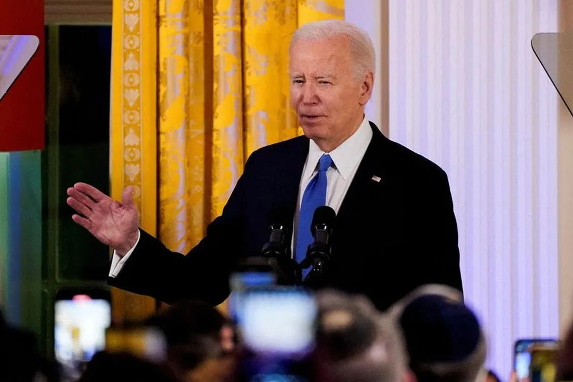 FILE PHOTO: U.S. President Joe Biden delivers remarks during a Hanukkah reception at the White House in Washington, U.S., December 11, 2023. REUTERS/Elizabeth Frantz/Pool/File Photo