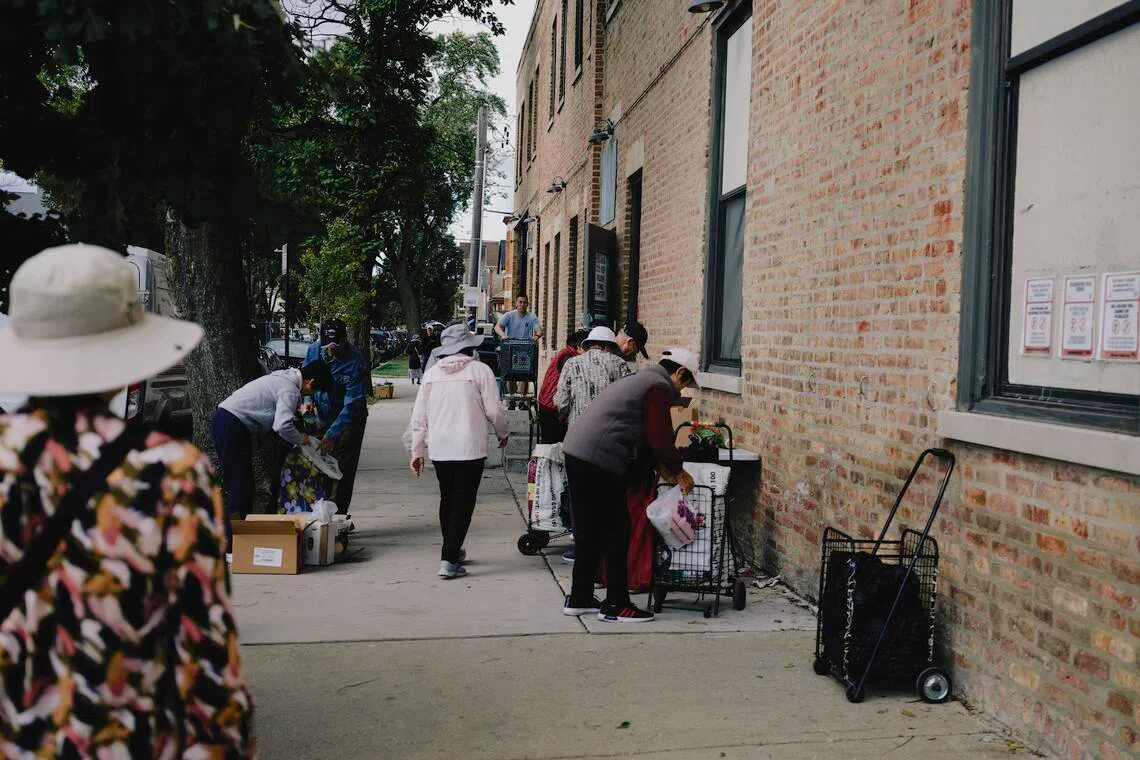 People queuing outside of Pilsen Food Pantry in Chicago on Oct 8. 