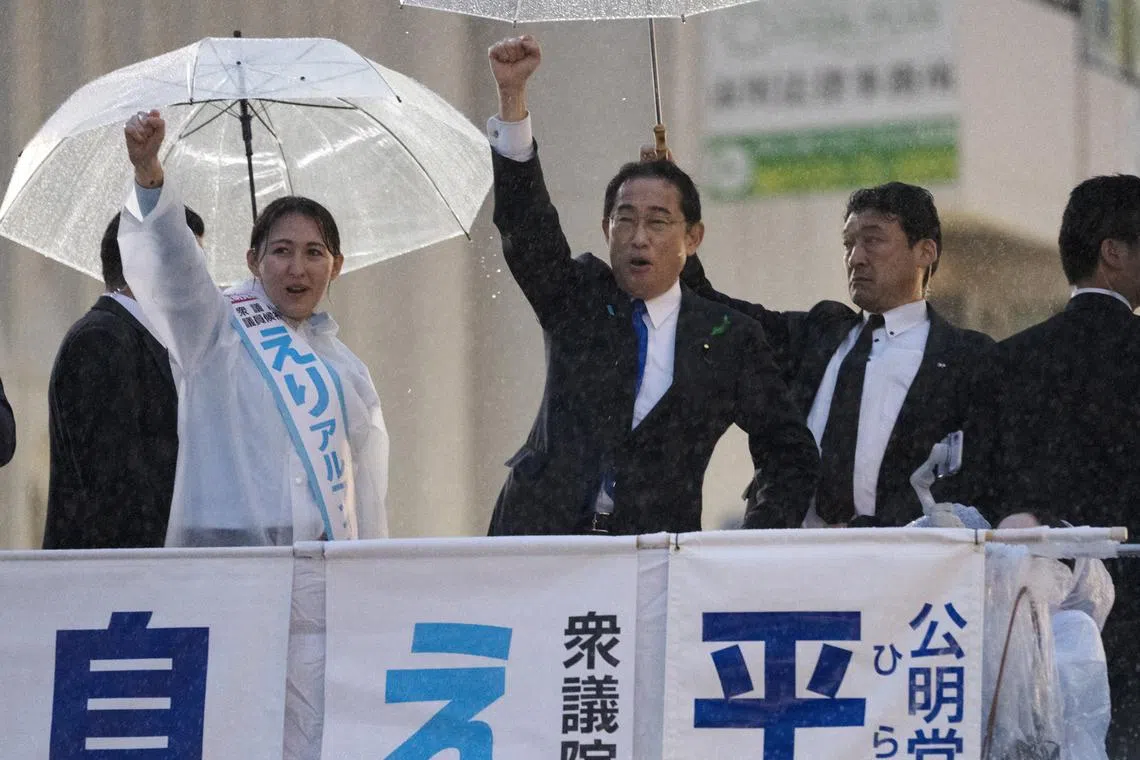Japanese PM Fumio Kishida (centre) said Japan must not allow acts of violence that attack the foundation of democracy.