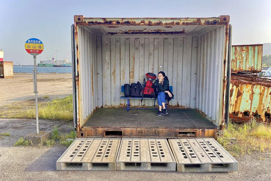 Authors Li-Ann Tan and Jon Song's adventures include taking a cargo ferry to Tanegashima from Kagoshima’s Taniyama port, which has a distinct container bus stop.