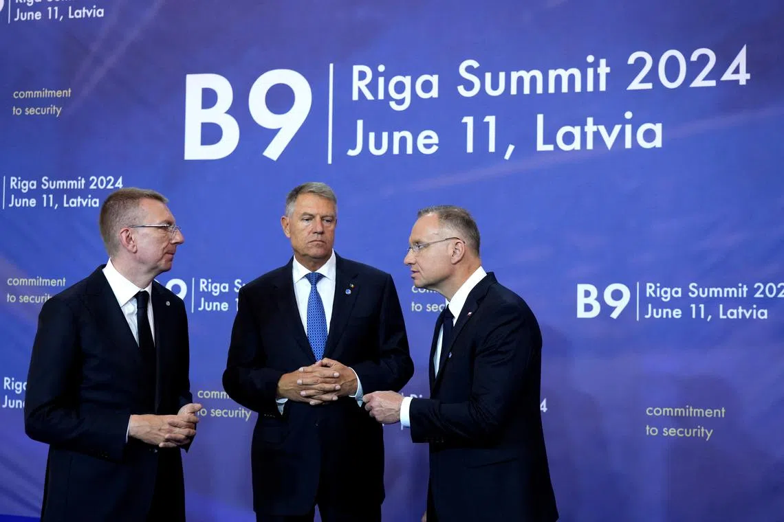 Latvian President Edgars Rinkevics, Romania's President Klaus Iohannis and Poland's President Andrzej Duda attend the Bucharest Nine (B9) format, also known as NATO's Eastern Flank Summit in Riga, Latvia June 11, 2024. REUTERS/Ints Kalnins