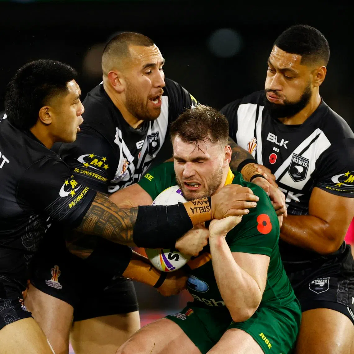 Rugby League - World Cup - Semi Final - Australia v New Zealand - Elland Road, Leeds, Britain - November 11, 2022 New Zealand's Nelson Asofa-Solomona, Briton Nikora and Moses Leota in action with Australia's Angus Crichton. Action Images via Reuters/Andrew Boyers
