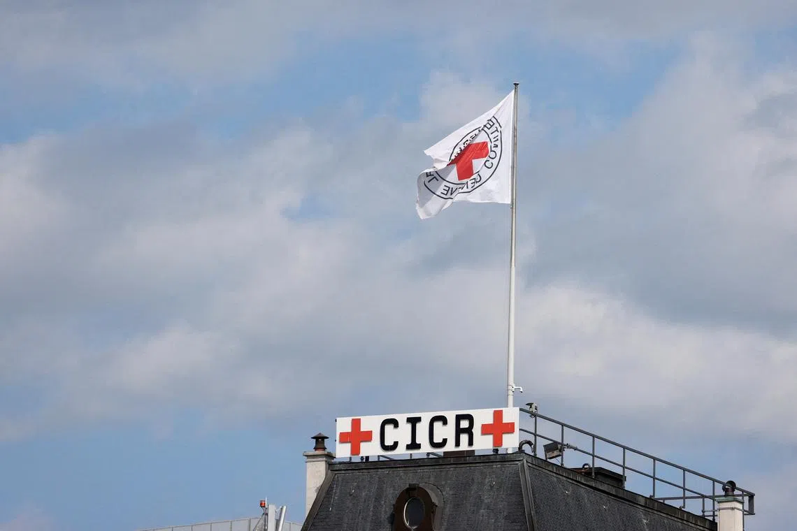 FILE PHOTO: The ICRC flag is seen on the headquarters of the International Committee of the Red Cross (ICRC) in Geneva, Switzerland, June 28, 2022. REUTERS/Denis Balibouse/File Photo