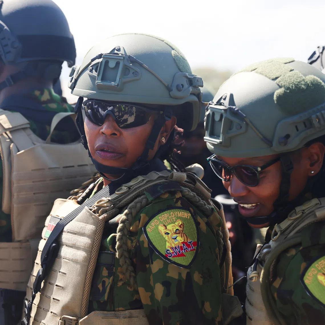 Kenyan police officers share a moment after landing to reinforce a security mission to tackle violence in Haiti, in Port-au-Prince, Haiti February 6, 2025. REUTERS/Ralph Tedy Erol