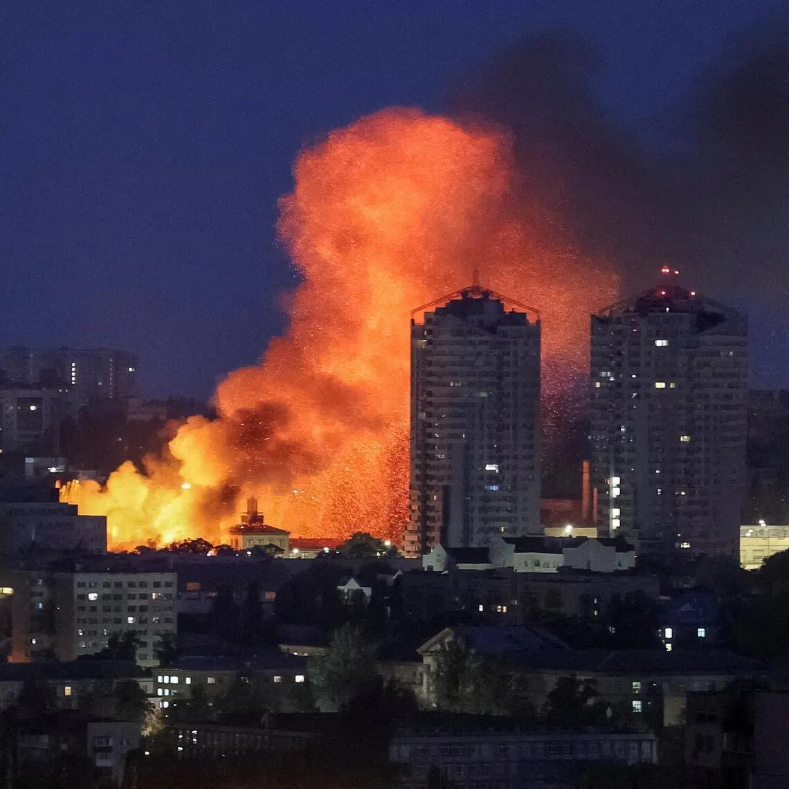 Fire and smoke rise in the aftermath of a Russian drone strike in Kyiv.