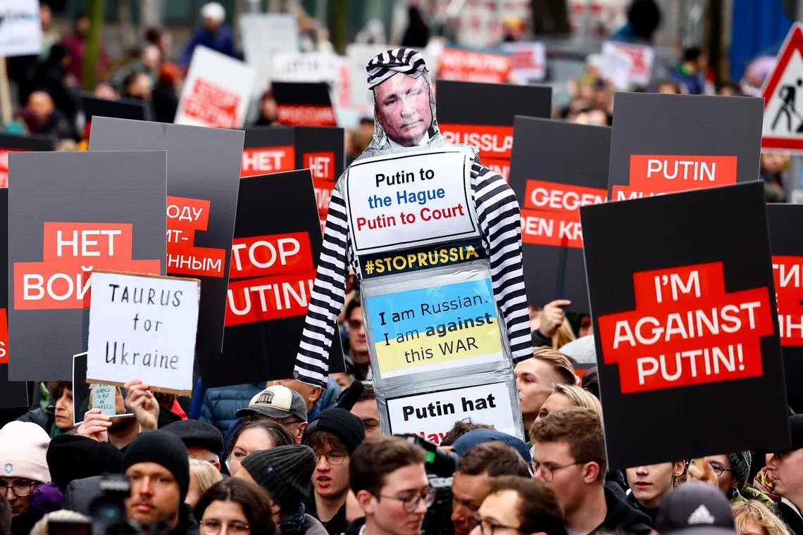 People attend an anti-war demonstration in Berlin. Organisers estimated the turnout to be at 2,000 people.  