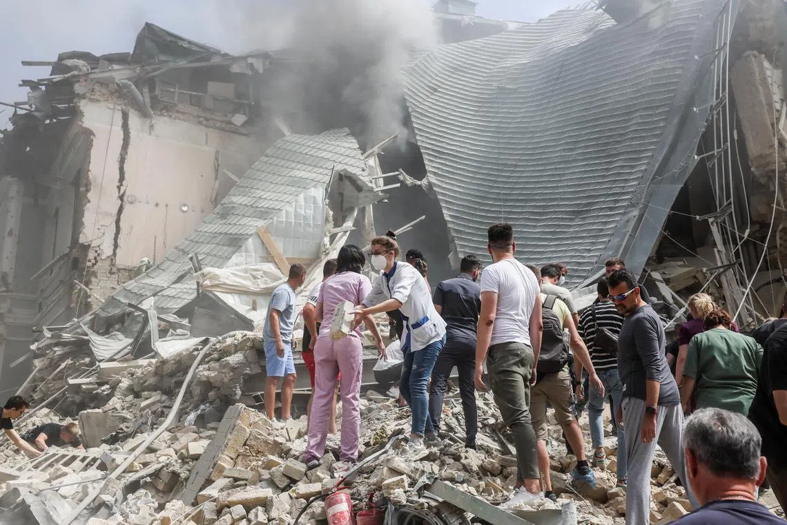 Hundreds of people rushed to clear debris at the hospital, where windows had been smashed and panels ripped off.