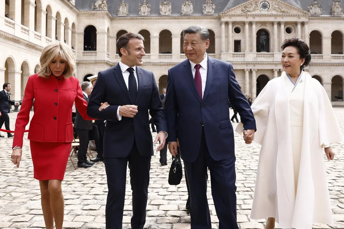(Left to right) French First Lady Brigitte Macron, French President Emmanuel Macron, Chinese President Xi Jinping and his wife Peng Liyuan walk together at the end of the official welcoming ceremony at the Hotel national des Invalides in Paris, France, on May 6, 2024. The Chinese President arrived on an official two-day state visit hosted by the French President, where the French leader will seek to push his counterpart on issues ranging from Ukraine to trade.  