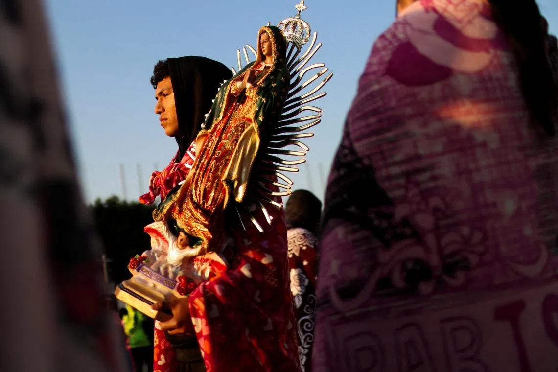 A pilgrim carrying an image of the Virgin during the annual Virgin of Guadalupe feast day, in Mexico City, Mexico, Dec 12, 2024. 