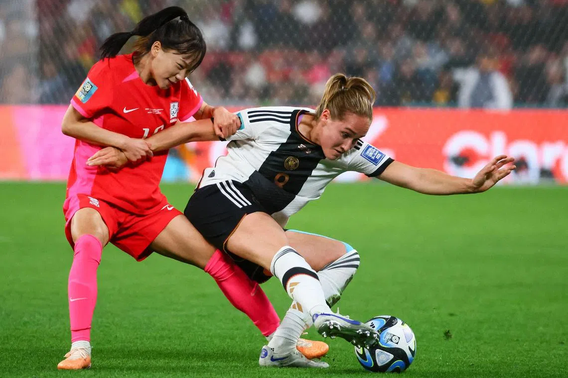 South Korea defender Jang Sel-gi and Germany midfielder Sydney Lohmann compete for the ball during their 1-1 Women's World Cup draw.