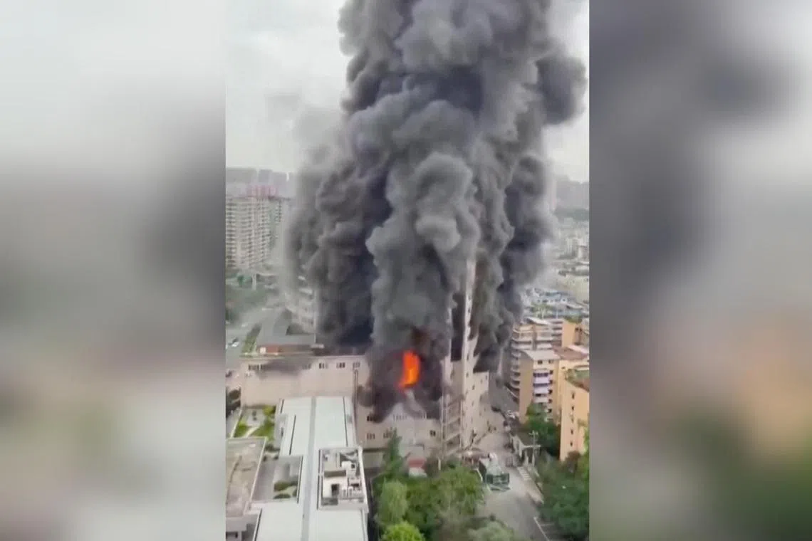 The fire broke out in a 14-storey building in a high-tech zone of the city of Zigong, shrouding the vicinity with thick smoke.