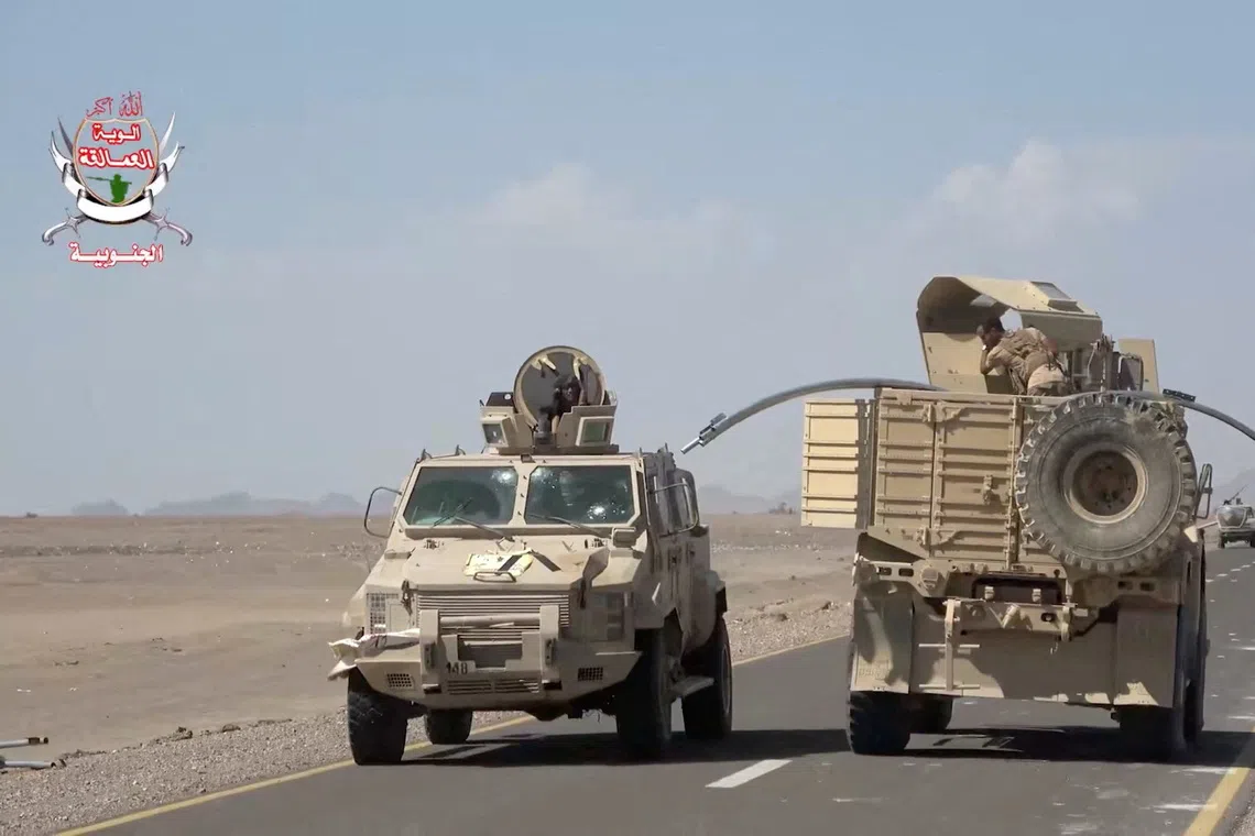 Military vehicles travel along a road during what Saudi-backed Yemeni government forces say was an advance against the Iran-backed Houthis, near Dhubab, Taiz Governorate, Yemen, in this still image taken from video released October 5, 2026.    Southern Giants Brigades/Handout via REUTERS