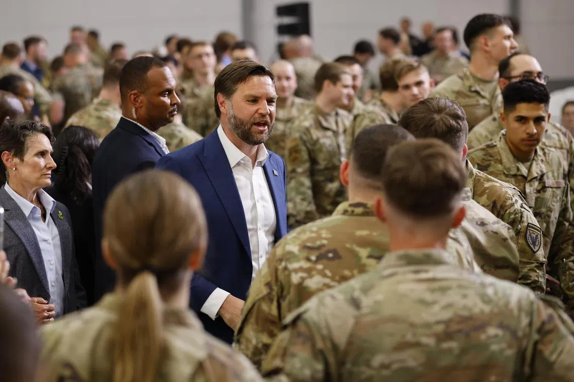 US Vice-President J. D. Vance (centre) meeting US military personnel stationed at the Fairford Royal Air Force base in Britain, on Aug 13.
