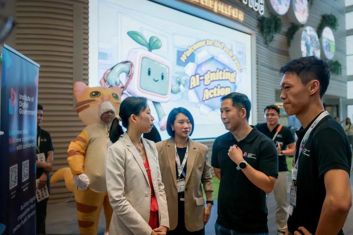 Senior Minister of State for Digital Development and Information Jasmin Lau (left) touring the AI Tech Festival during the launch of the Institute of Digital Government on Sept 18.