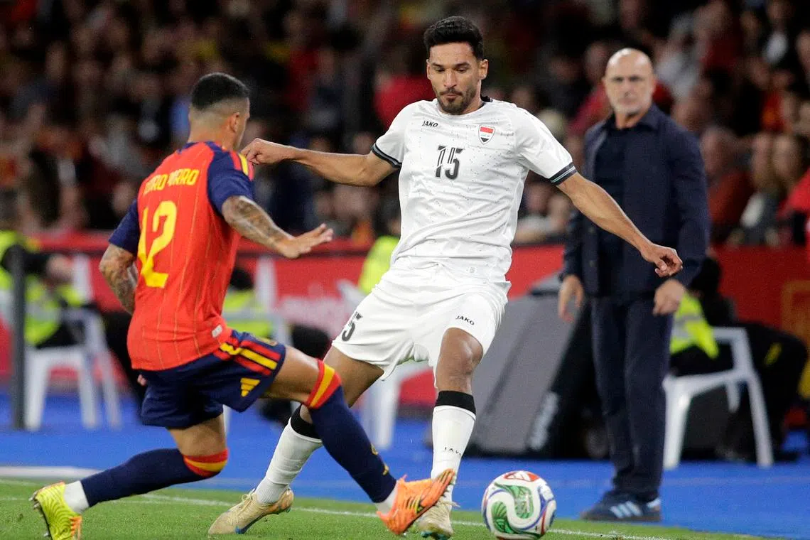 Soccer Football - International Friendly - Spain v Iraq - Riazor stadium, A Coruna, Spain - June 4, 2026 Iraq's Ahmed Yahya Mhmood Al Hajjaj in action with Spain's Pedro Porro REUTERS/Miguel Vidal
