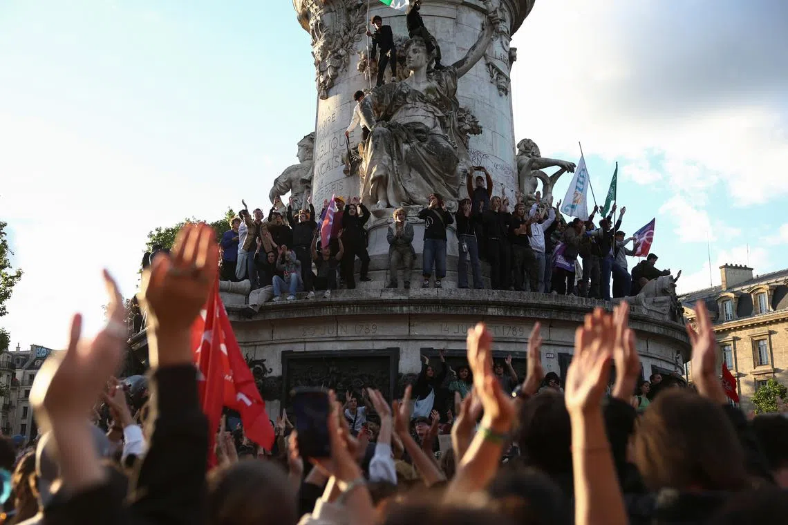 FILE PHOTO: People gather to protest against the French far-right National Rally (Rassemblement National - RN) party at Place de la Republique in Paris, after French far-right win in European Parliament vote and the announcement of early legislative elections in France, June 10, 2024. REUTERS/Stephanie Lecocq/File Photo