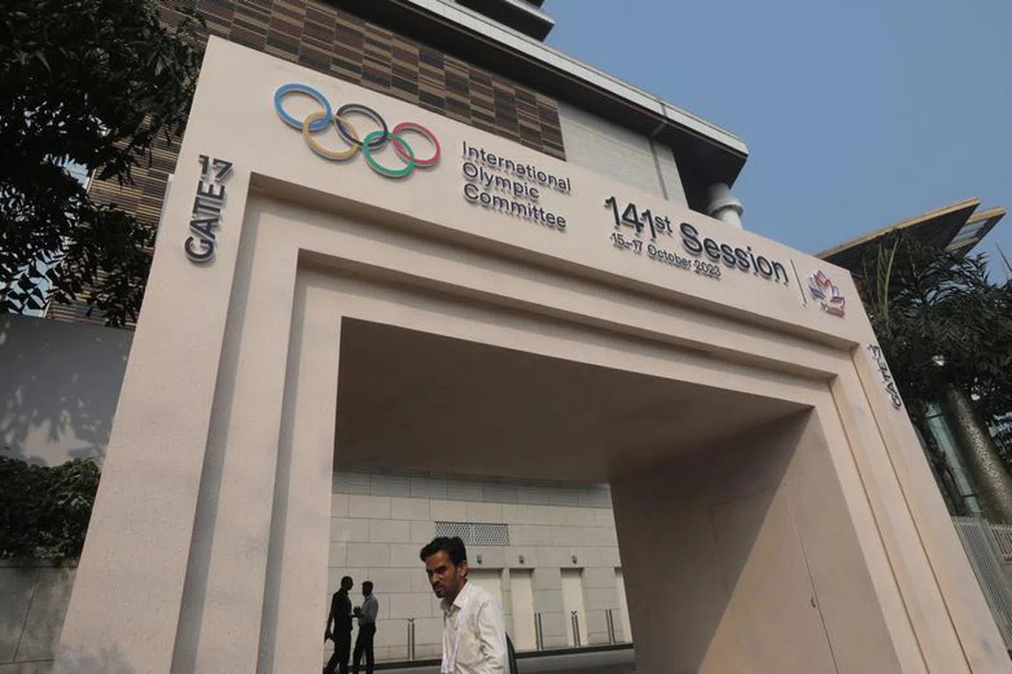 A man walks past the entrance of the 141st IOC Session venue, in Mumbai, India, October 13, 2023. REUTERS/ Niharika Kulkarni