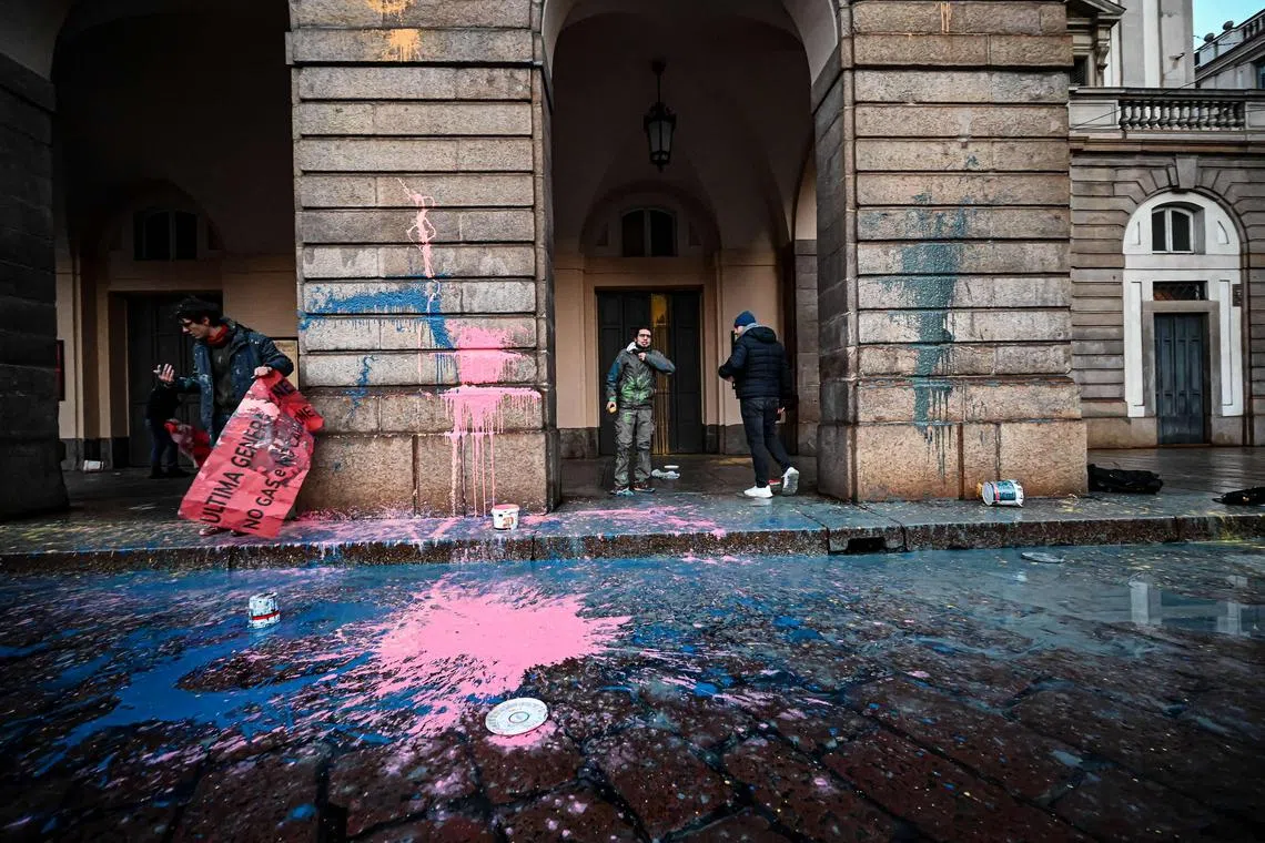 Environmental activist from the Last Generation group smear paint on the facade of the La Scala theatre, on Dec 7, 2022.