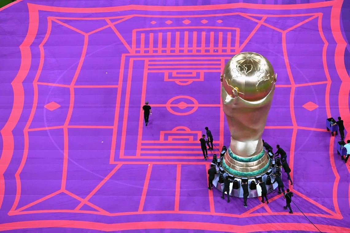 A replica of the World Cup trophy is displayed ahead of the start of the Qatar 2022 World Cup Group E football match between Costa Rica and Germany at the Al-Bayt Stadium in Al Khor, north of Doha on December 1, 2022. 