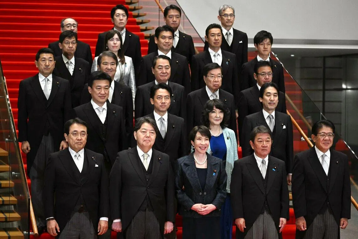 Sanae Takaichi, Japan's prime minister, front row center, during a group photograph with her new Cabinet members at the prime minister's office in Tokyo, Japan, on Oct. 21, 2025. 