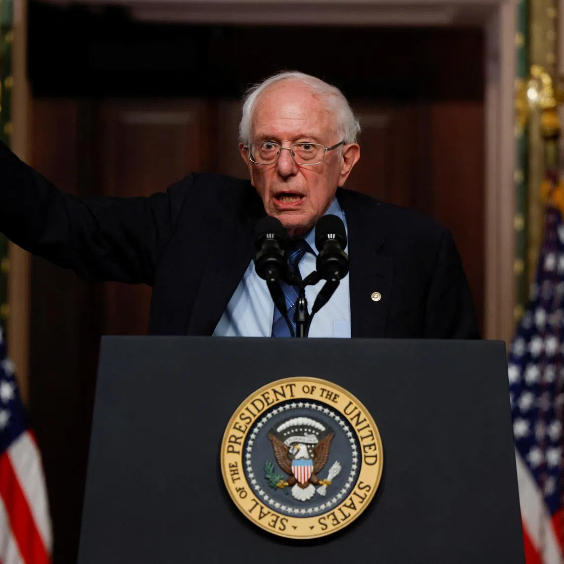 FILE PHOTO: U.S. Senator Bernie Sanders (I-VT) gestures while delivering remarks on lowering healthcare costs, in the Indian Treaty Room of the Eisenhower Executive Office building, at the White House complex in Washington, U.S., April, 3, 2024. REUTERS/Evelyn Hockstein/File Photo