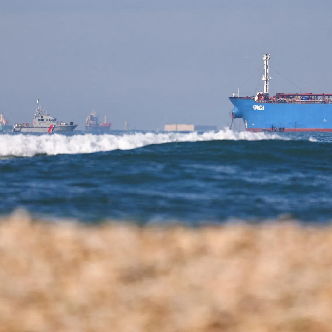 A French navy boat surrounds the GRINCH oil tanker, intercepted by France in the Alboran Sea on suspicion of operating under a false flag and belonging to Russia's shadow fleet that enables Russia to export oil despite sanctions, and diverted to the port of Marseille-Fos, in the Gulf of Fos-sur-Mer, near Martigues, France, January 25, 2026. REUTERS/Manon Cruz/File Photo
