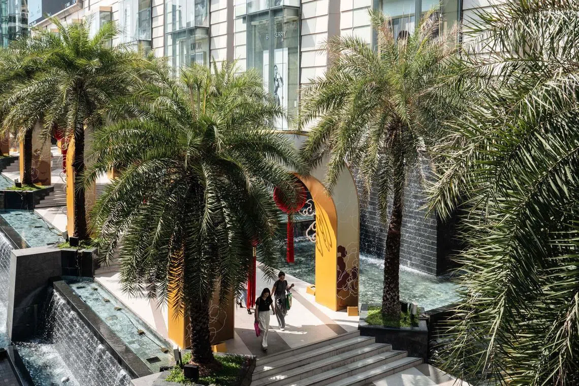 Pedestrians walk outside a luxury shopping mall in Bangkok. The push to draw more Middle Eastern travellers is part of Thailand’s ongoing campaign to lure more affluent visitors.