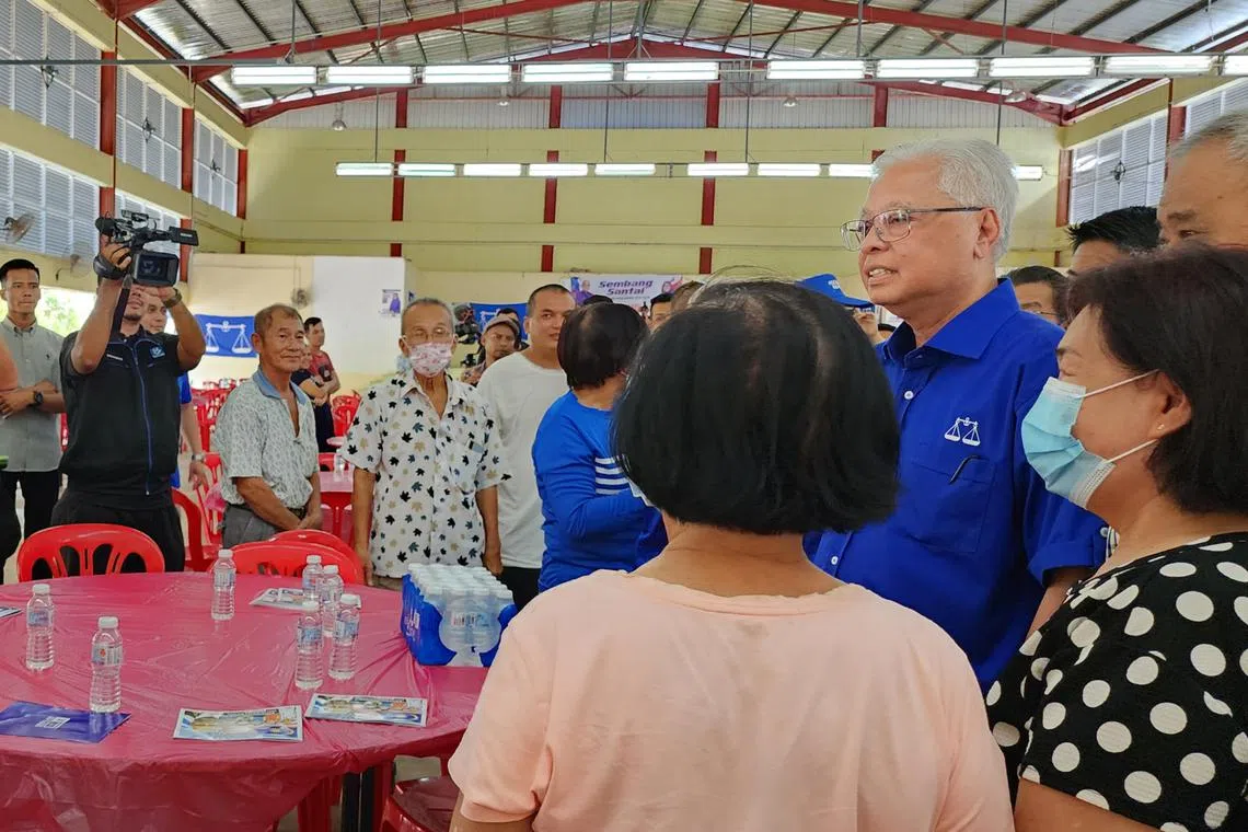 Malaysia's caretaker PM Ismail Sabri Yaakob meets voters in Mengkarang on Nov 16, 2022.