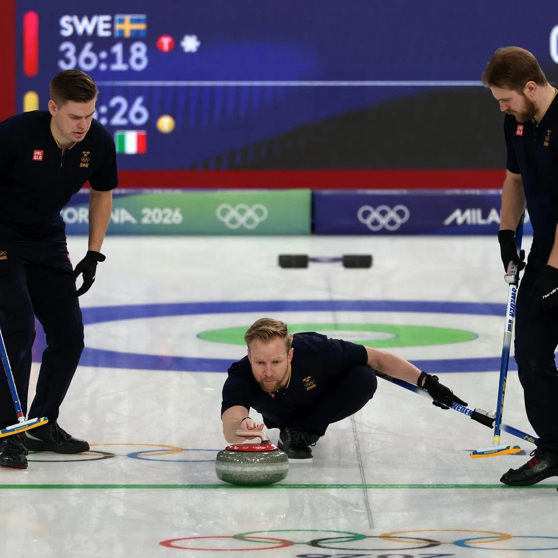 Milano Cortina 2026 Olympics - Curling - Men's Round Robin Session 1 - Sweden vs Italy - Cortina Curling Olympic Stadium, Cortina d'Ampezzo, Italy - February 11, 2026. Niklas Edin of Sweden, Rasmus Wrana of Sweden and Christoffer Sundgren of Sweden in action during Men's Round Robin Session 1. REUTERS/Issei Kato