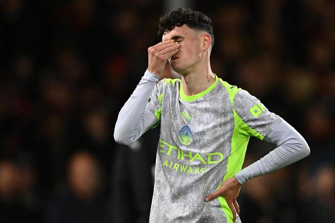 Manchester City's Phil Foden looking dejected after Arsenal are confirmed as the Premier League champions following City's 1-1 draw at Bournemouth on May 19.