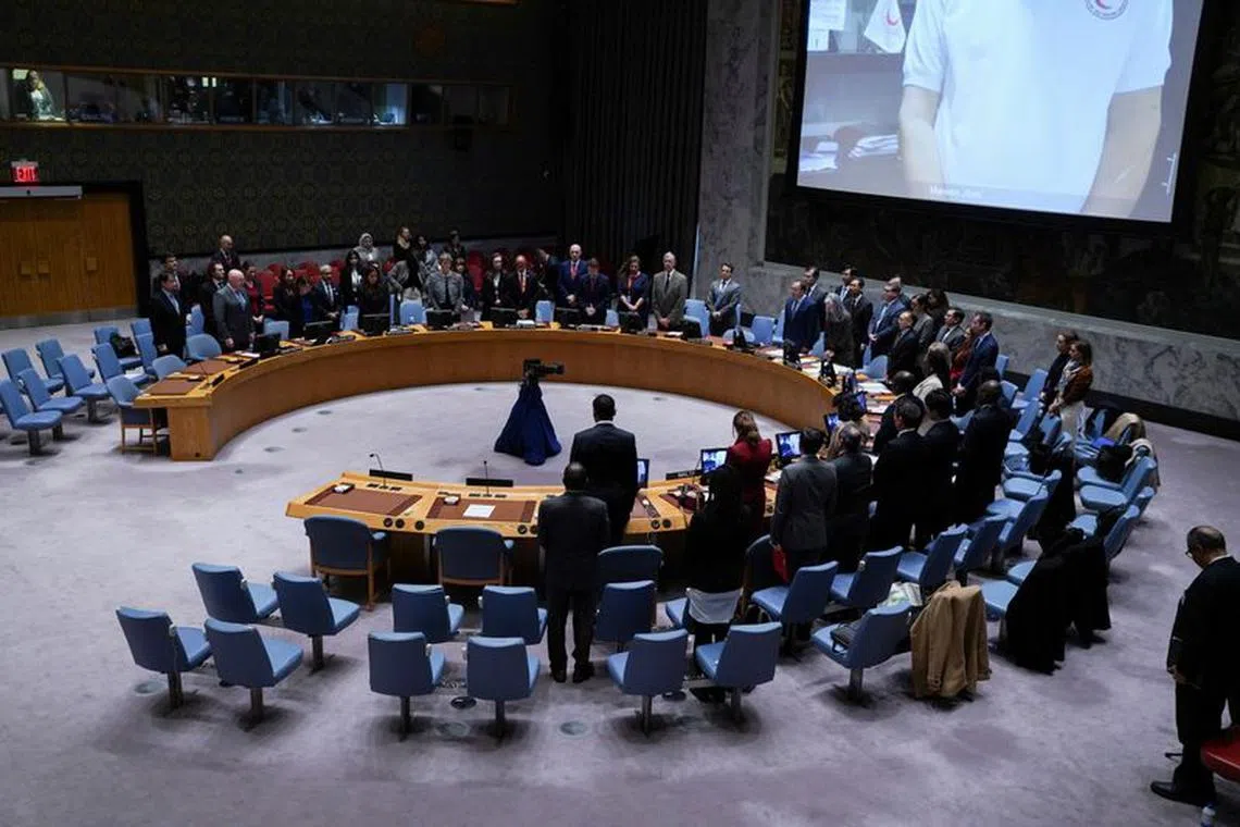 FILE PHOTO: Delegates observe a minute of silence for the victims of the October 7 attack on Israel by Palestinian Islamist group Hamas and for Palestinians who died in the conflict between Israel and Hamas, during a meeting of the United Nations Security Council, at U.N. headquarters in New York, U.S., November 10, 2023. REUTERS/David 'Dee' Delgado/File photo
