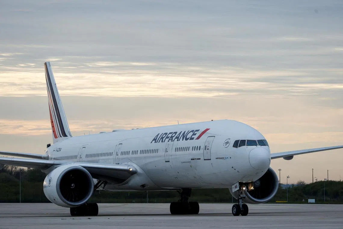 FILE PHOTO: An Air France plane carrying French nationals and other European citizens, who have been evacuated from Sudan via Djibouti, is seen at the Paris-Charles de Gaulle airport in Roissy, near Paris, France, April 26, 2023. REUTERS/Stephanie Lecocq/File Photo