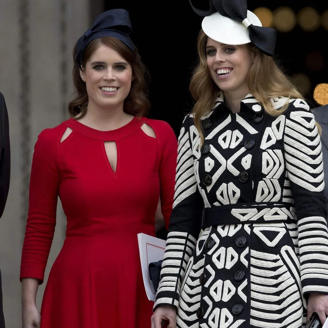 Britain's former prince Andrew (left) with his daughters, Princess Eugenie (centre) and Princess Beatrice (right).  