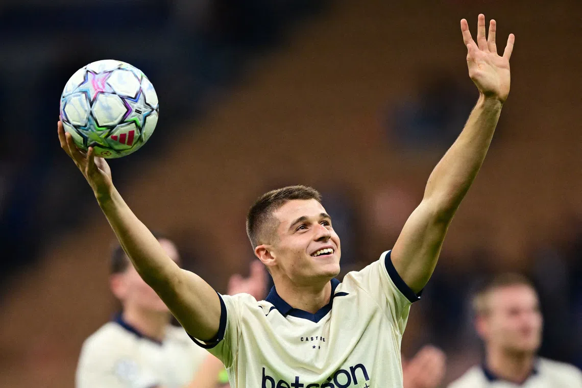 Soccer Football - UEFA Champions League - Inter Milan v Club Brugge - San Siro, Milan, Italy - October 13, 2026 Club Brugge's Nicolo Tresoldi celebrates after the match with the match ball having scored a hat-trick REUTERS/Daniele Mascolo     TPX IMAGES OF THE DAY