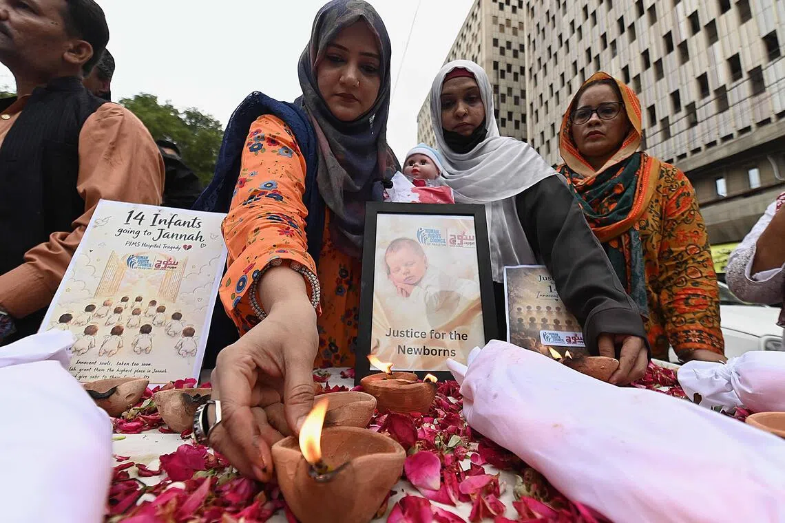 Pakistan suspends eight officials after deadly infant ward fire