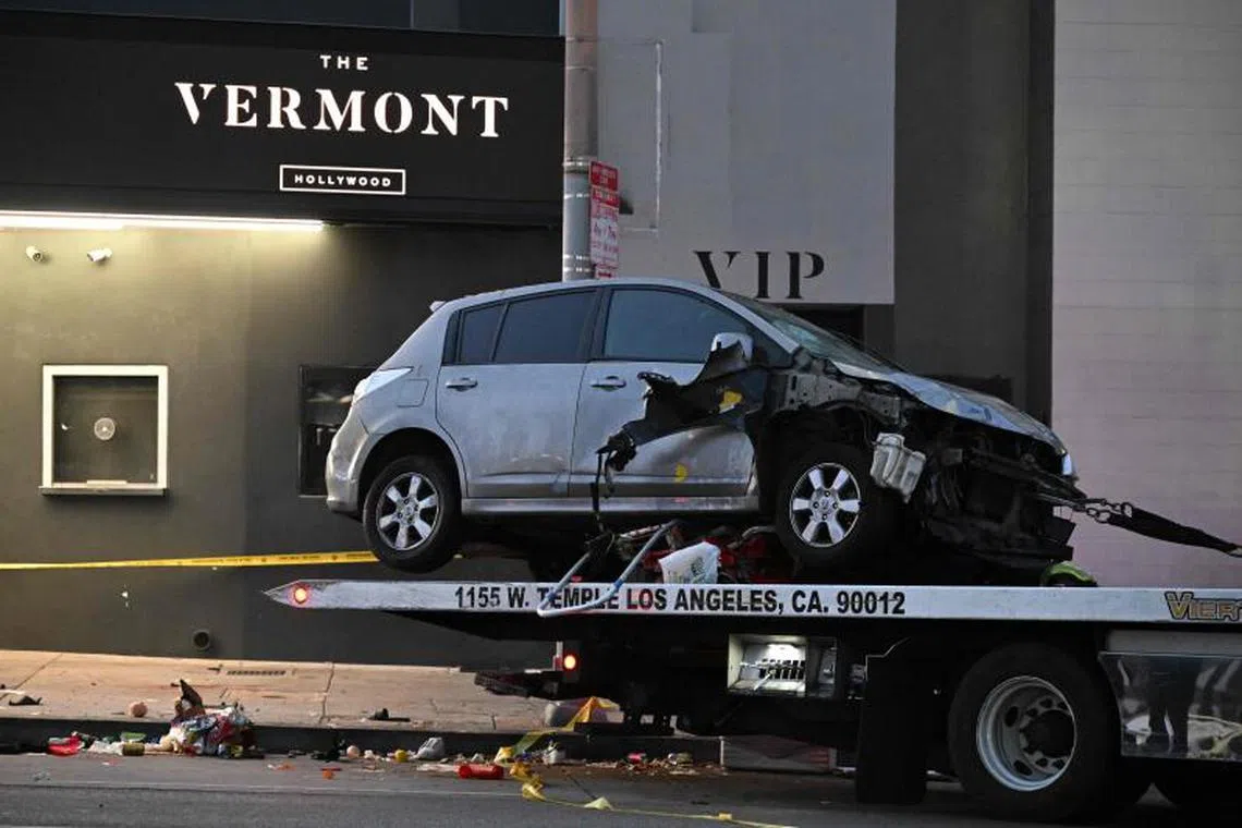 A vehicle is being taken away after it drove into a crowd in Hollywood in the early hours of July 19, 2025.