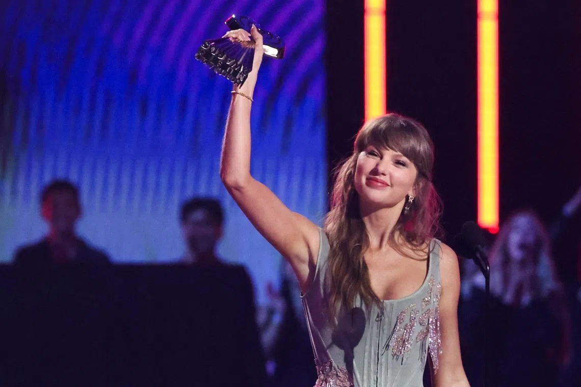 Taylor Swift accepts the Pop Album of the Year award, one of seven trophies she picked up, at the 2026 iHeartRadio Music Awards in Los Angeles on March 26.