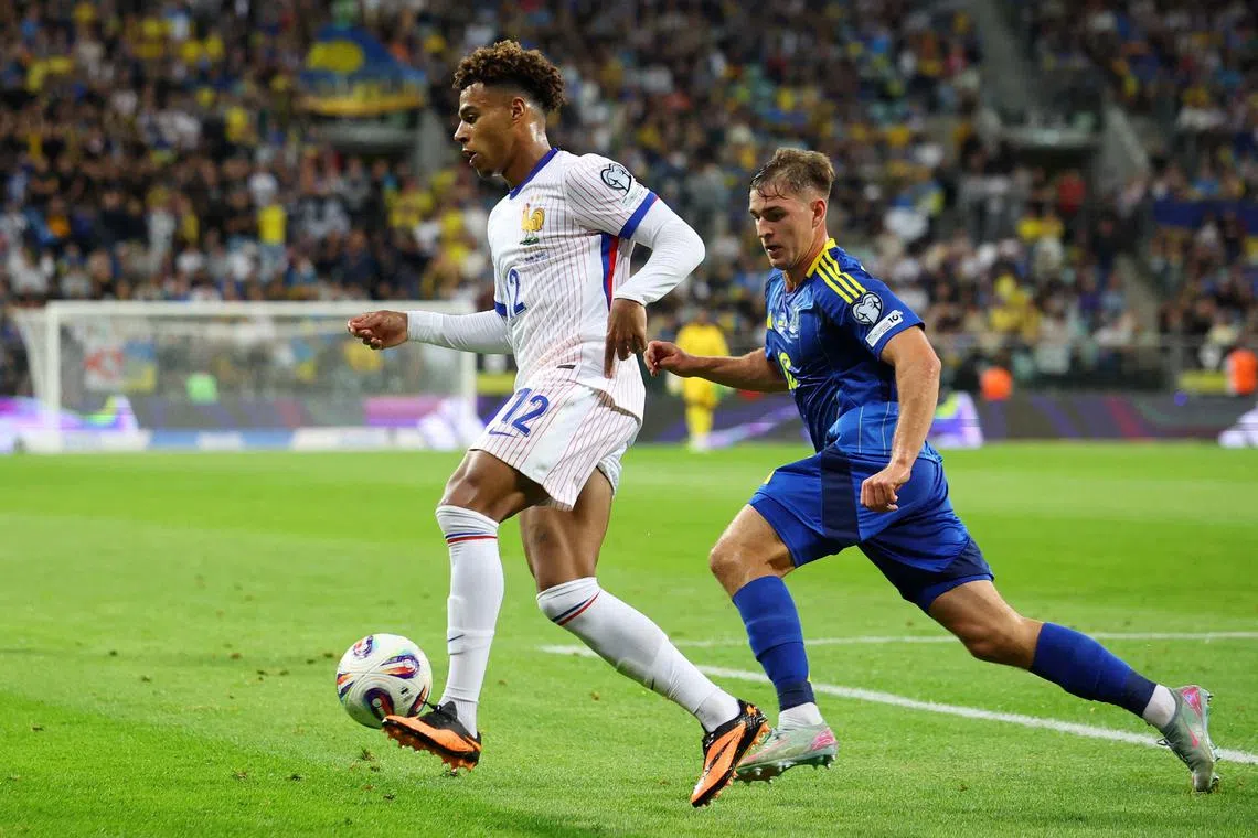FILE PHOTO: Soccer Football - World Cup - UEFA Qualifiers - Group D - Ukraine v France - Wroclaw Stadium, Wroclaw, Poland - September 5, 2025 France's Desire Doue in action with Ukraine's Yehor Yarmoliuk REUTERS/Kacper Pempel/File Photo