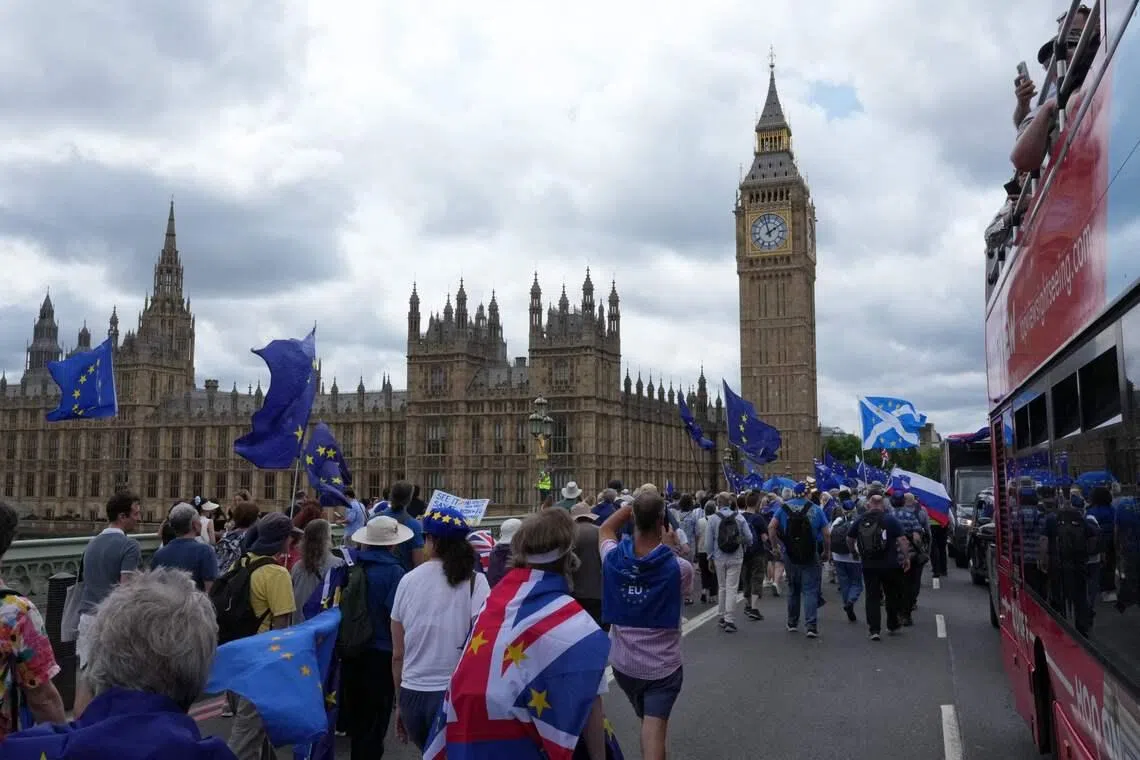People marching over Westminster Bridge in London on June 20 to campaign for Britain to rejoin the European Union.